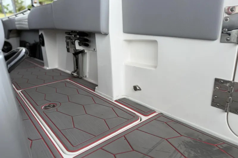 Slide: The Image of 2022 Fountain 34 SC boat interior with sleek, modern flooring and seating. - 21