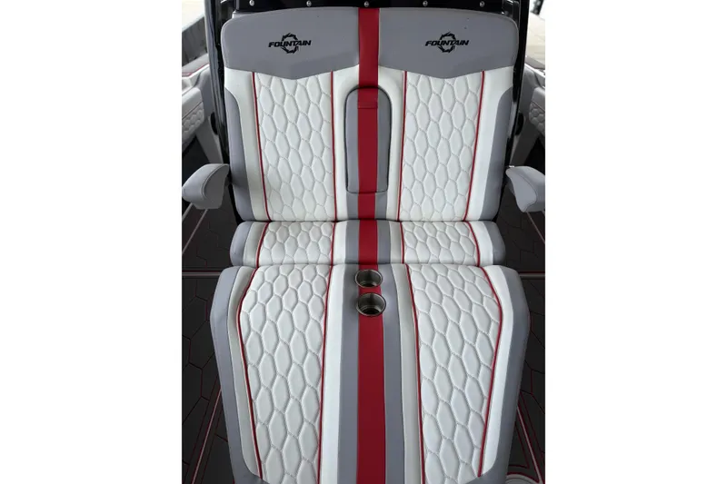 Slide: The Image of Luxury seating in 2022 Fountain 34 SC boat with white and red upholstery. - 27