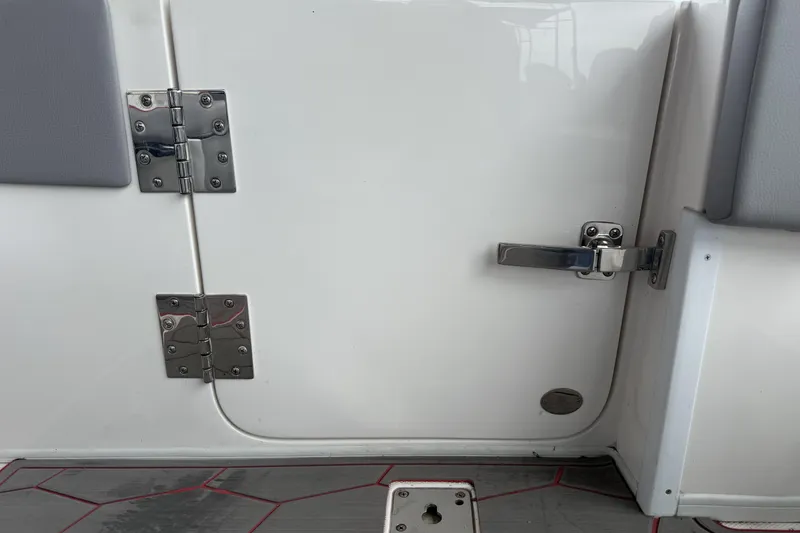 Slide: The Image of 2022 Fountain 34 SC boat door with stainless steel hinges and latch. - 29