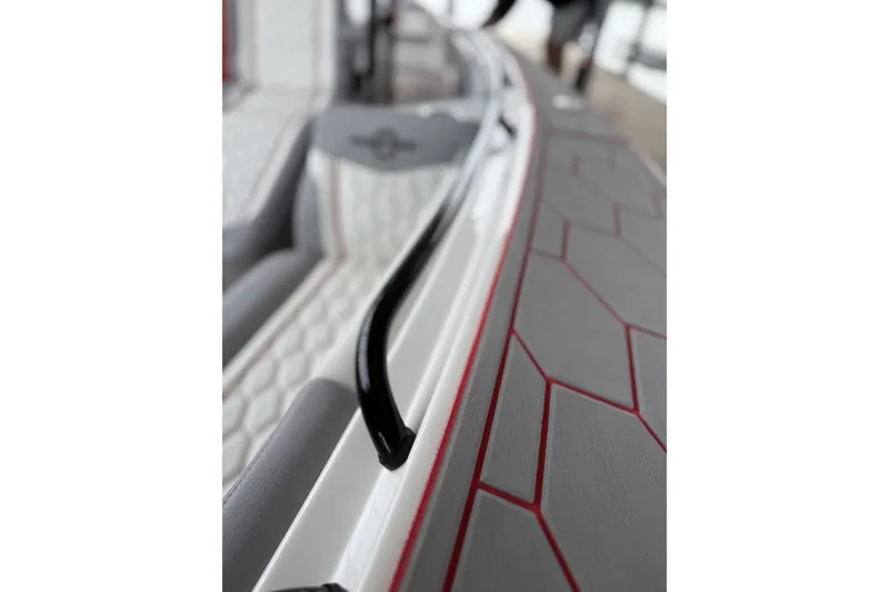 Slide: The Image of Close-up of 2022 Fountain 34 SC boat interior with sleek design and textured flooring. - 30