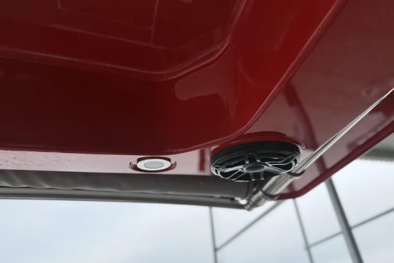Slide: The Image of Red 2022 Fountain 34 SC boat with speaker and light detail. - 32