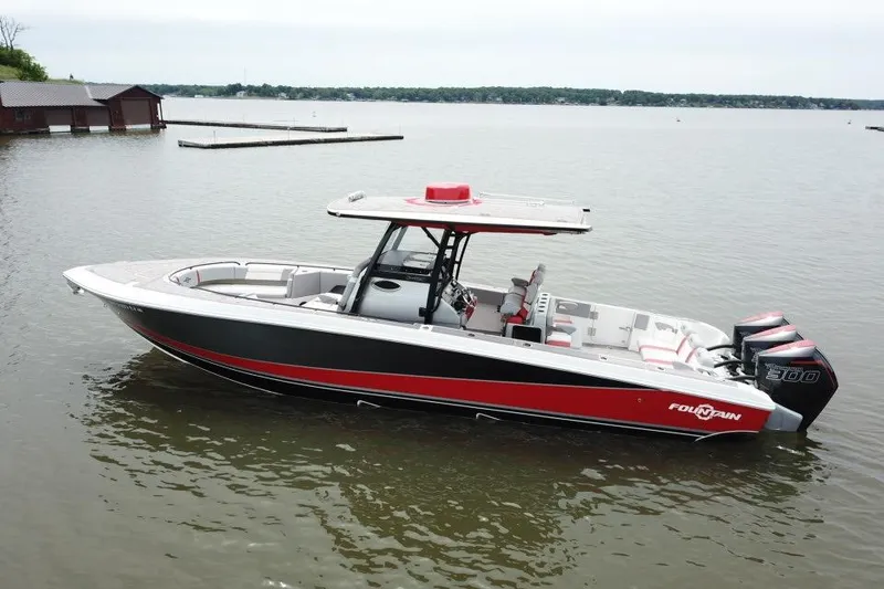 Slide: The Image of 2022 Fountain 34 SC boat with triple engines on a calm lake. - 8