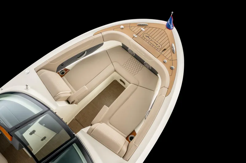 Slide: The Image of 2026 Chris-Craft Sportster 28 boat interior with elegant seating and teak accents. - 11