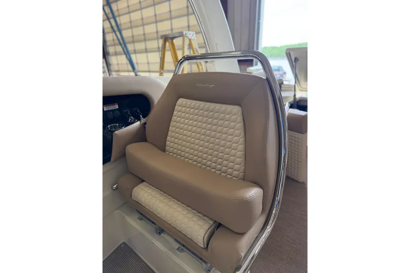 Slide: The Image of 2026 Chris-Craft Launch 31 GT boat seat with beige quilted upholstery. - 10