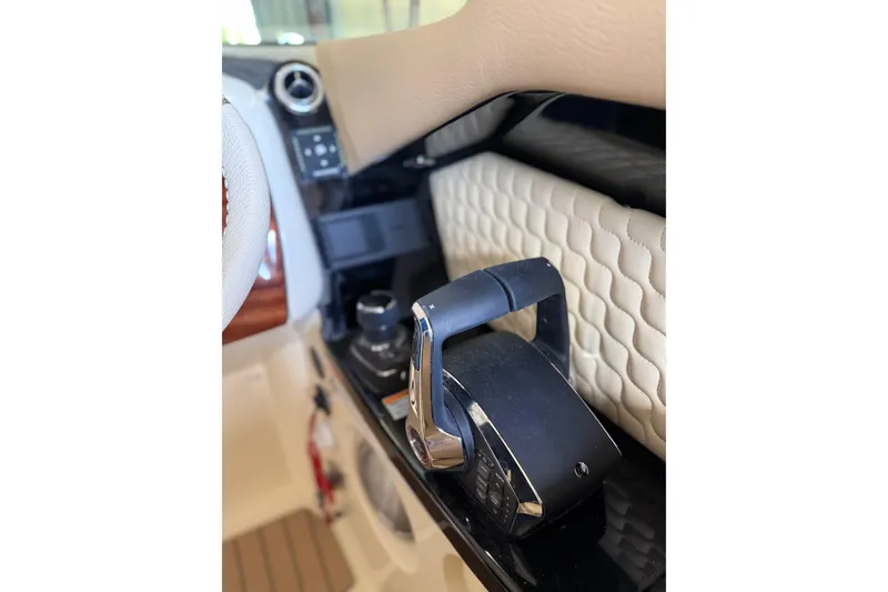 Slide: The Image of 2026 Chris-Craft Launch 31 GT interior, featuring a sleek throttle control and quilted upholstery. - 11