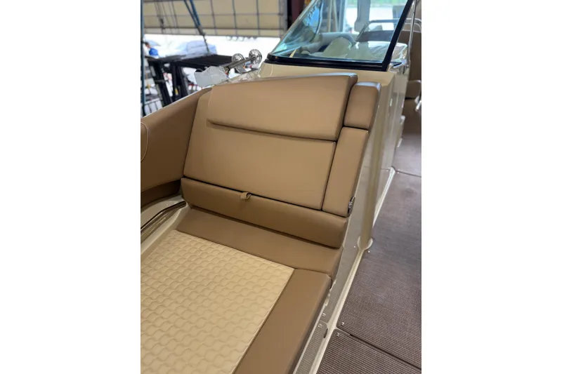 Slide: The Image of Luxurious seating on 2026 Chris-Craft Launch 31 GT boat, featuring tan upholstery and sleek design. - 14