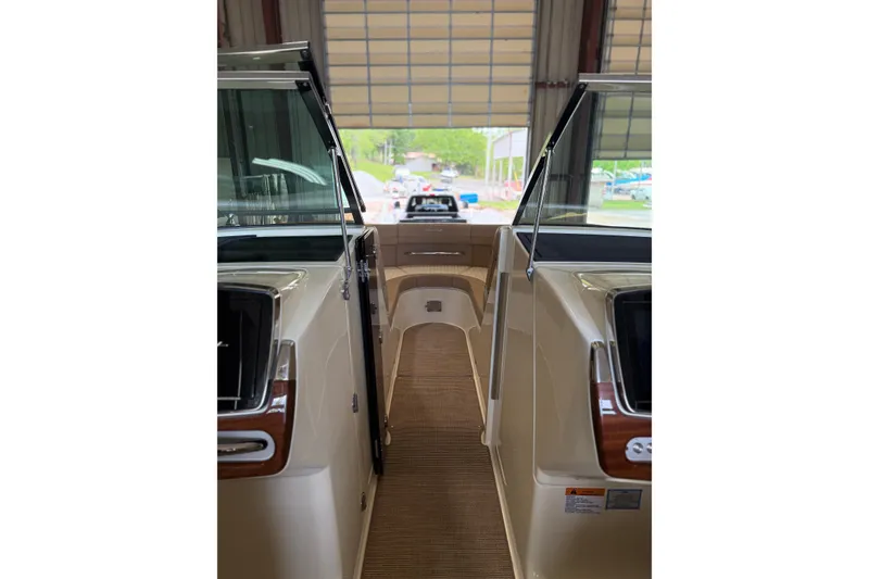 Slide: The Image of 2026 Chris-Craft Launch 31 GT interior view in a garage setting. - 7