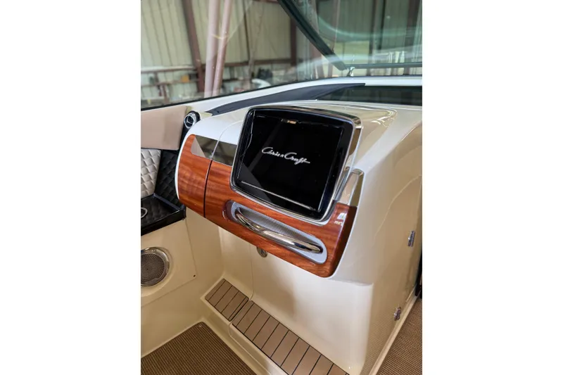 Slide: The Image of Dashboard of 2026 Chris-Craft Launch 31 GT with wood accents and modern design. - 8