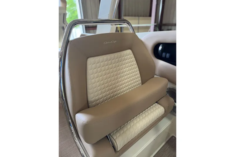 Slide: The Image of Luxurious seating in the 2026 Chris-Craft Launch 31 GT boat, featuring elegant beige upholstery. - 9