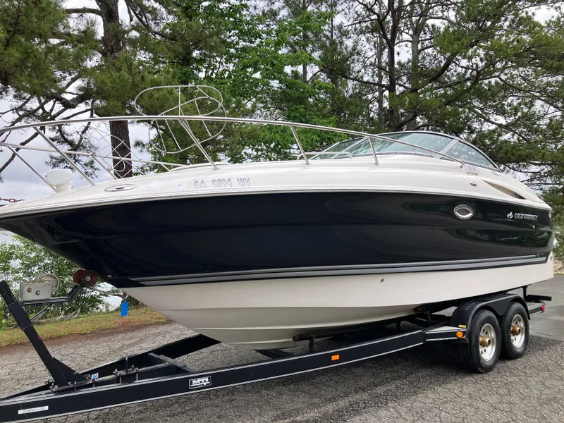 Slide: The Image of 2006 Monterey 250 SC boat on trailer outdoors. - 1