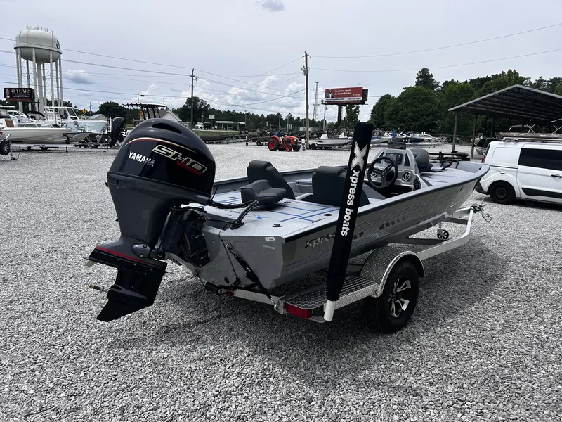 Slide: The Image of 2026 Xpress H17 boat with Yamaha motor on trailer. - 8