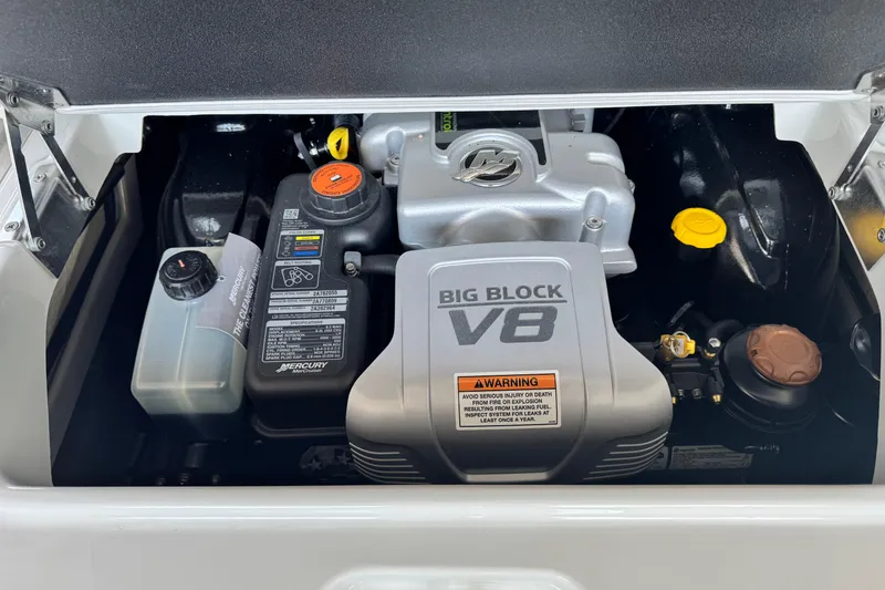Slide: The Image of 2024 Crownline 290 SS engine compartment featuring a powerful Big Block V8 engine. - 12