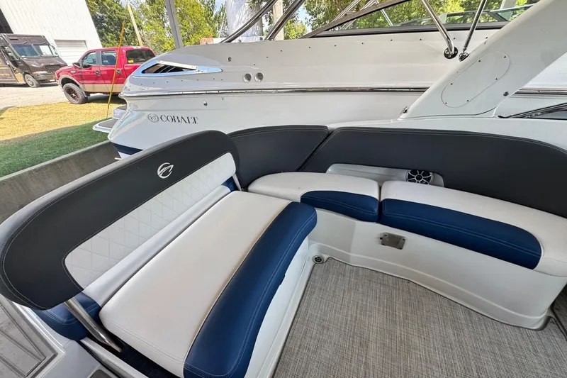 Slide: The Image of 2024 Crownline 290 SS boat interior with stylish seating and modern design. - 5