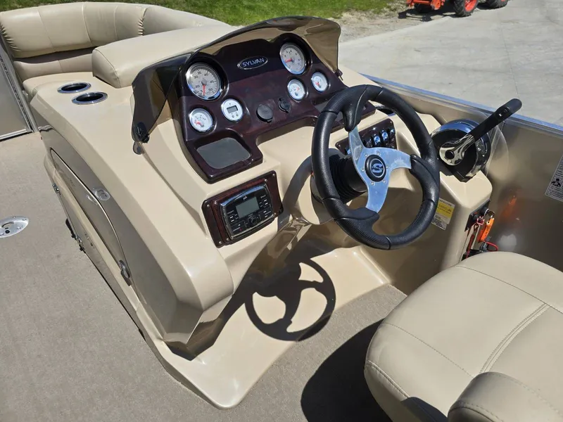 Slide: The Image of Dashboard of a 2015 Sylvan Mirage 8522 pontoon boat. - 14