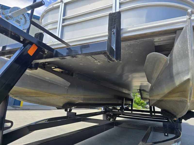 Slide: The Image of Underside of a 2015 Sylvan Mirage 8522 pontoon boat on a trailer. - 24