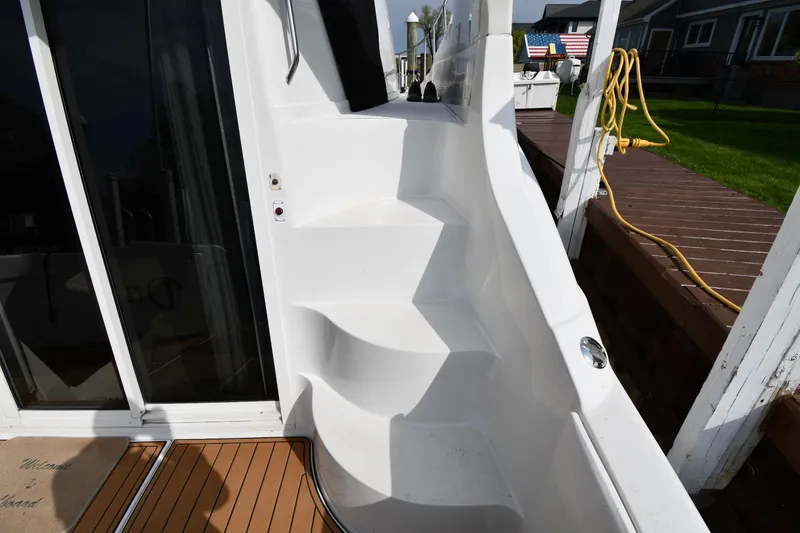 Slide: The Image of Staircase on 2000 Carver 350 Mariner yacht, leading to upper deck, with wooden flooring. - 11