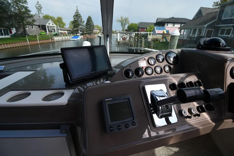 Slide: The Image of Cockpit view of 2000 Carver 350 Mariner with navigation equipment and gauges. - 14