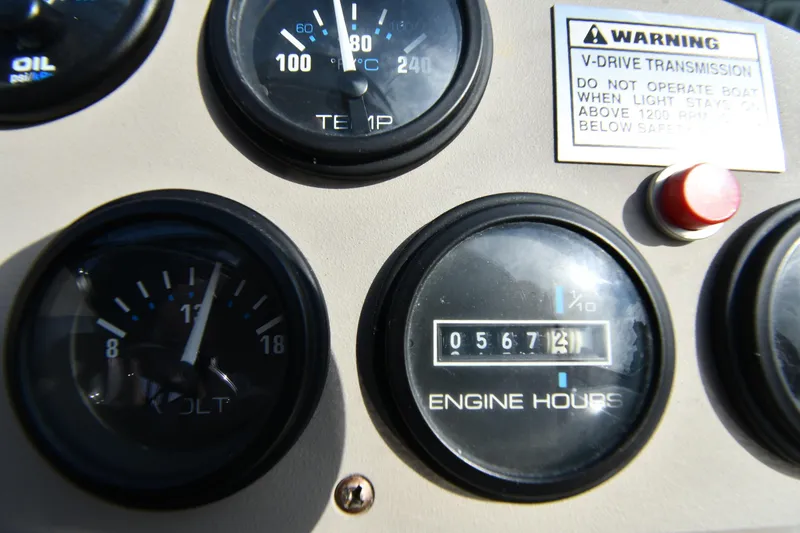 Slide: The Image of Close-up of Carver 350 Mariner 2000 dashboard gauges and warning label. - 16