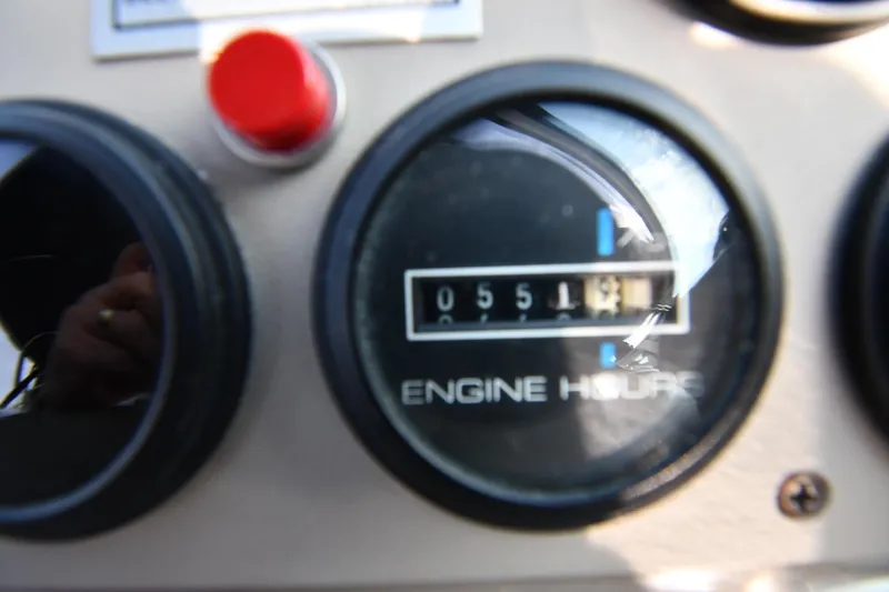 Slide: The Image of Close-up of Carver 350 Mariner 2000 engine hour meter showing 551 hours. - 17