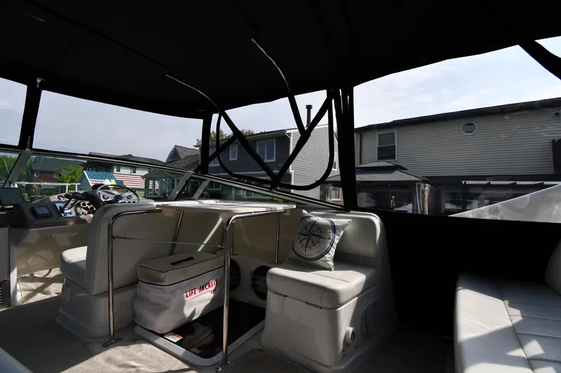 Slide: The Image of Interior of a 2000 Carver 350 Mariner boat with seating and life jackets. - 20