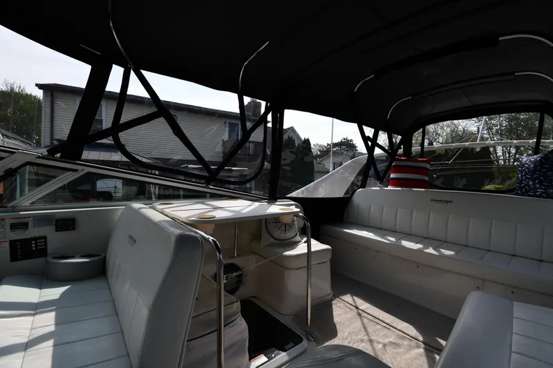 Slide: The Image of Interior of a 2000 Carver 350 Mariner boat with seating and helm. - 22