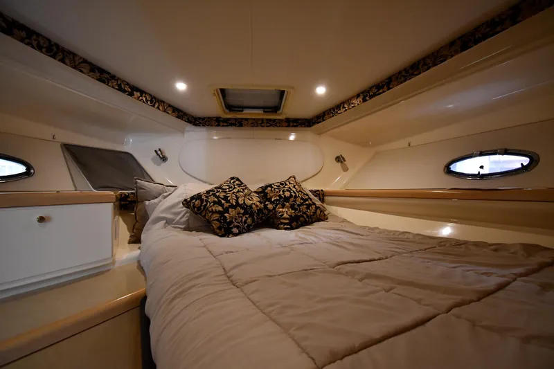 Slide: The Image of Luxurious cabin interior of 2000 Carver 350 Mariner yacht with elegant bedding. - 28