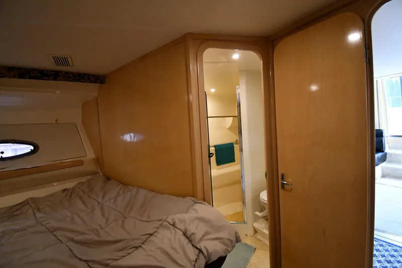 Slide: The Image of Interior cabin of 2000 Carver 350 Mariner yacht with bed and bathroom. - 32