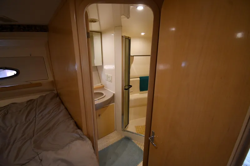 Slide: The Image of Interior of 2000 Carver 350 Mariner yacht showing cozy cabin and bathroom. - 33