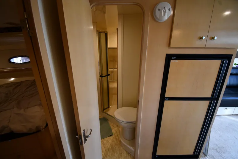 Slide: The Image of Interior of 2000 Carver 350 Mariner yacht showing bathroom and cabin area. - 35
