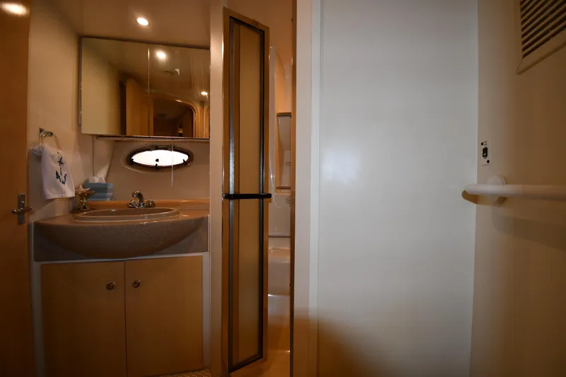 Slide: The Image of Interior of 2000 Carver 350 Mariner yacht bathroom with sink and shower. - 36