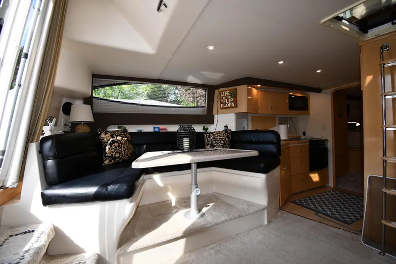 Slide: The Image of Interior of 2000 Carver 350 Mariner yacht with cozy seating and modern amenities. - 38
