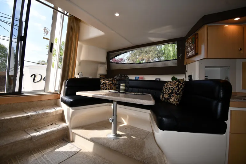Slide: The Image of Interior of 2000 Carver 350 Mariner yacht with cozy seating and elegant decor. - 39