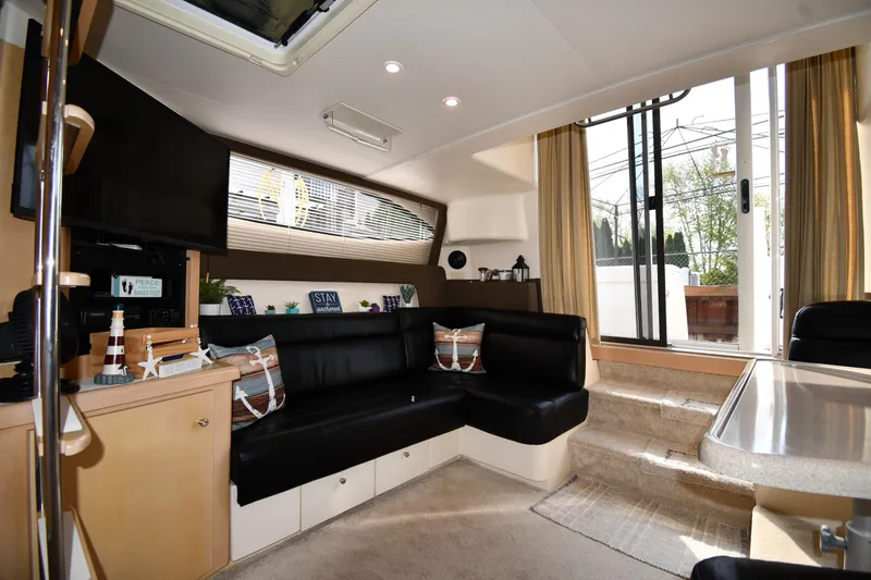 Slide: The Image of Interior of 2000 Carver 350 Mariner yacht with cozy seating and modern amenities. - 40
