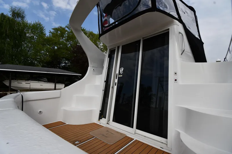 Slide: The Image of 2000 Carver 350 Mariner yacht with sleek design and spacious deck area. - 6