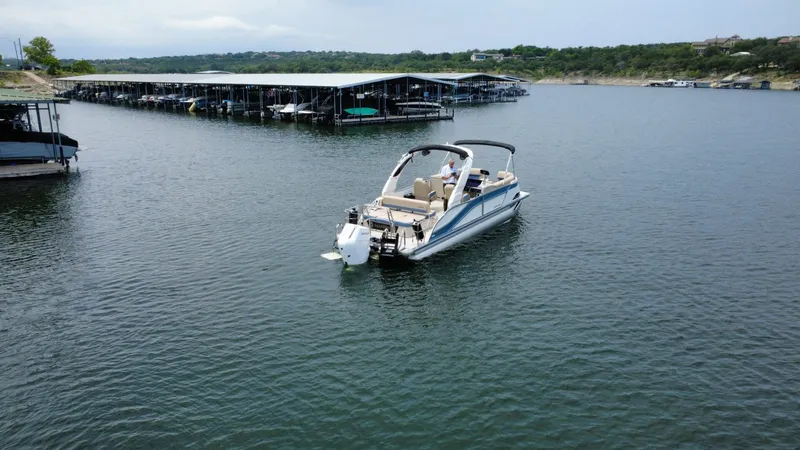 Slide: The Image of Harris Grand Mariner 230 boat 2026 on a calm lake. - 5