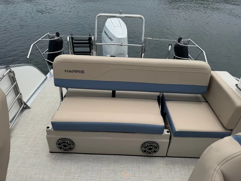 Slide: The Image of Harris Grand Mariner 230 boat 2026 with beige and blue seating area. - 9