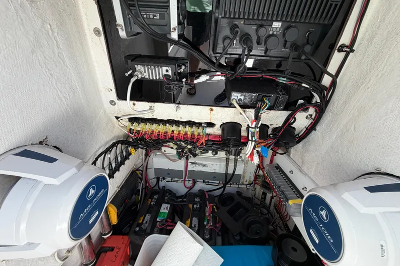 Slide: The Image of Electrical system inside a 2005 Competition 25 boat, featuring wiring and components. - 13
