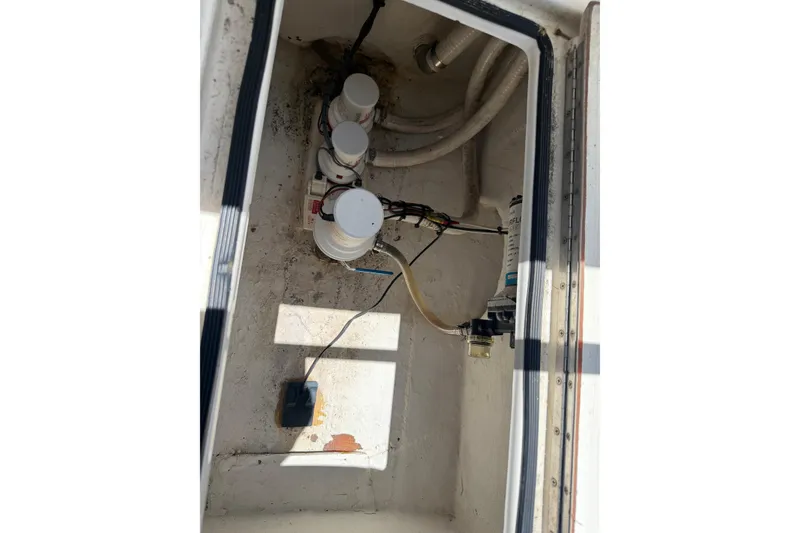 Slide: The Image of Bilge compartment of 2005 Competition 25 boat with pumps and wiring. - 21