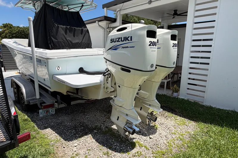 Slide: The Image of 2005 Competition 25 boat with twin Suzuki 200 outboard engines on a trailer. - 4