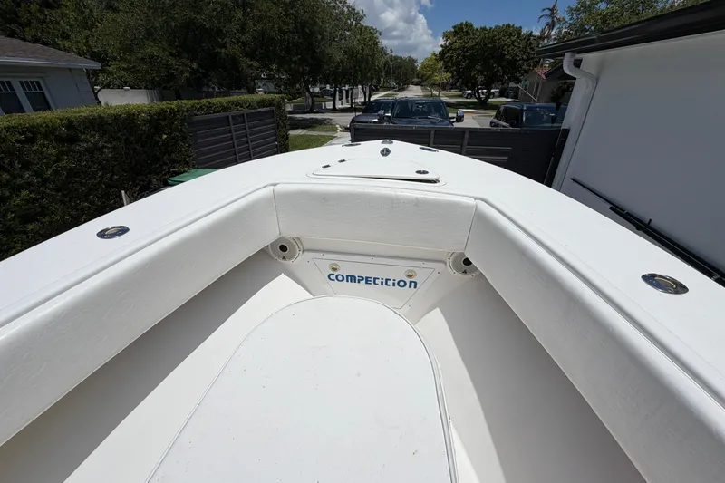 Slide: The Image of 2005 Competition 25 boat bow view, parked in a residential driveway under a clear sky. - 7