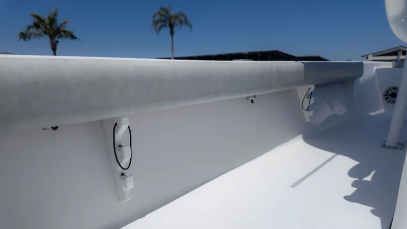 Slide: The Image of 2019 Sportsman Masters 267 Bay Boat interior view, blue sky. - 11