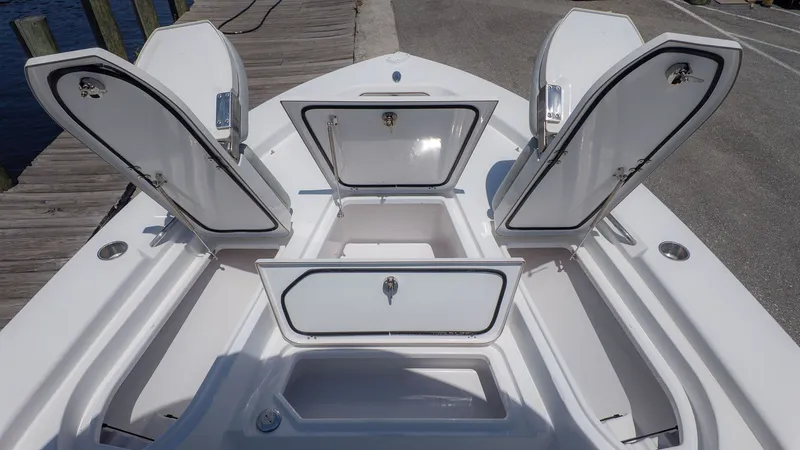 Slide: The Image of 2019 Sportsman Masters 267 Bay Boat with open storage compartments. - 15