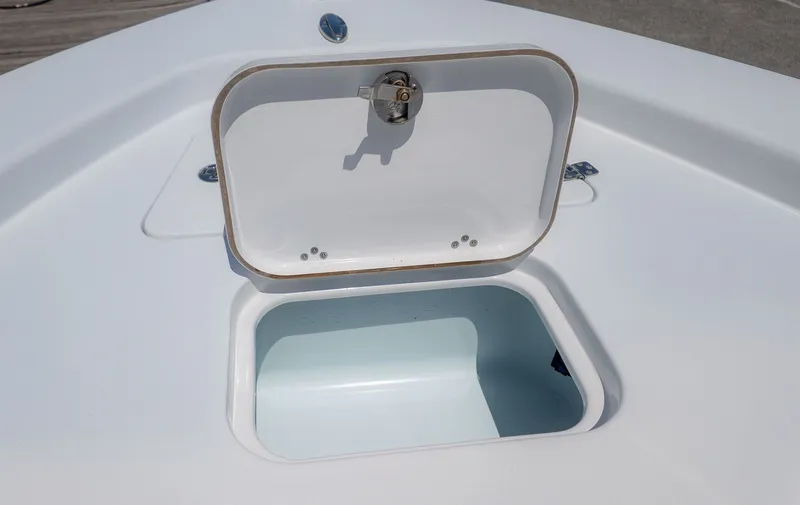 Slide: The Image of Open storage compartment on a 2019 Sportsman Masters 267 Bay Boat. - 16