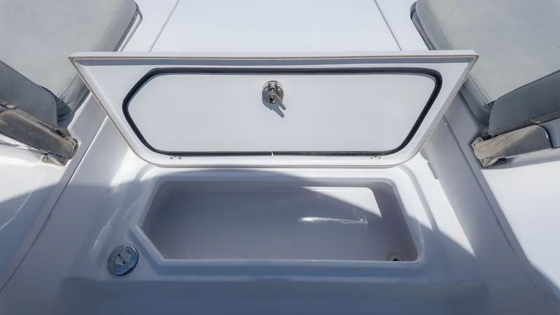 Slide: The Image of 2019 Sportsman Masters 267 Bay Boat storage compartment open. - 17