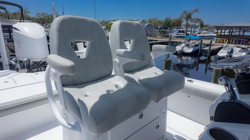 Slide: The Image of 2019 Sportsman Masters 267 Bay Boat with luxurious seats at the marina. - 19