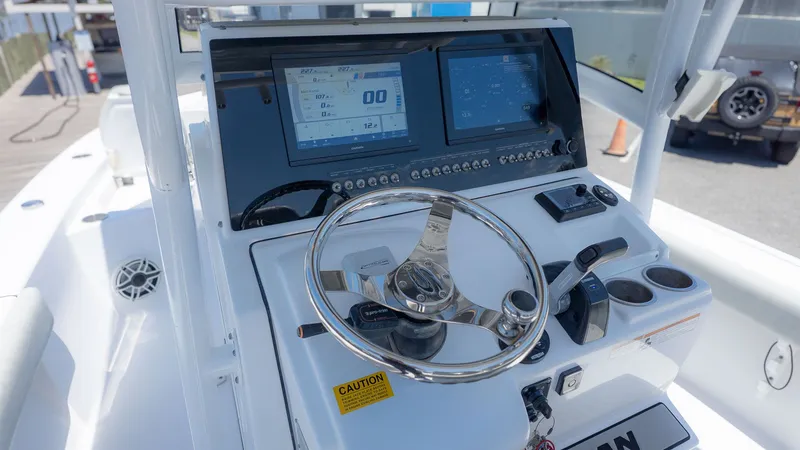 Slide: The Image of 2019 Sportsman Masters 267 Bay Boat helm with modern displays. - 21