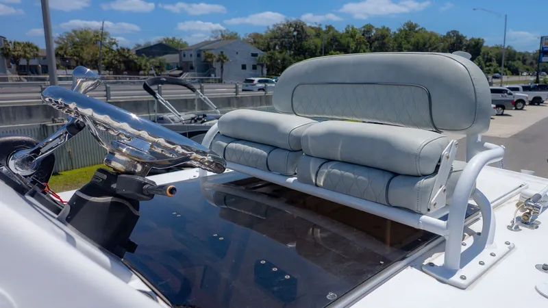Slide: The Image of 2019 Sportsman Masters 267 Bay Boat with cushioned seat and steering wheel. - 3