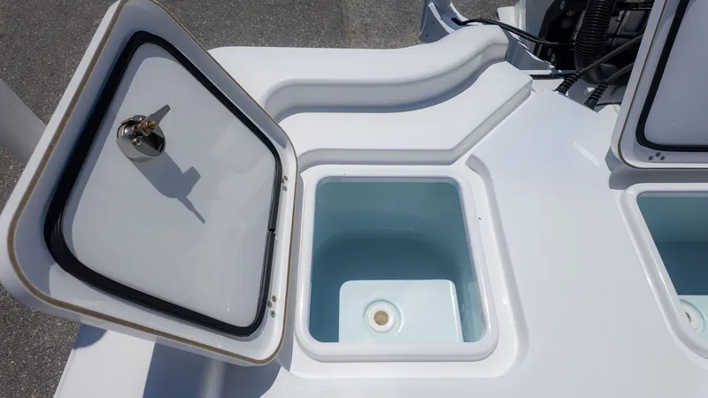 Slide: The Image of 2019 Sportsman Masters 267 Bay Boat with open storage compartment. - 9