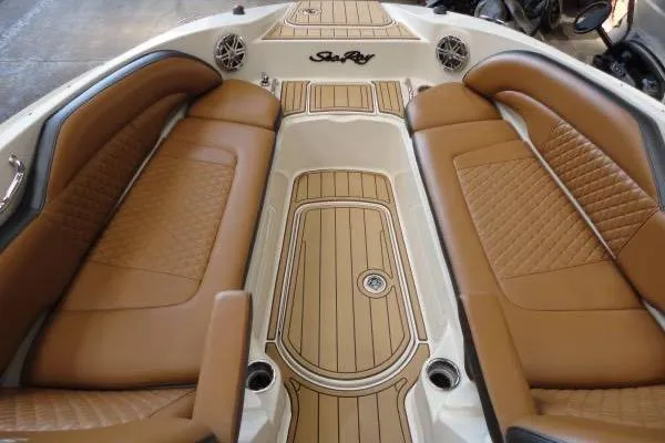 Slide: The Image of 2007 Sea Ray 260 Sundeck interior with tan leather seating and wood-style flooring. - 15