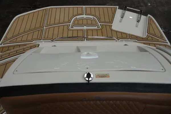Slide: The Image of 2007 Sea Ray 260 Sundeck swim platform with teak-style decking and ladder. - 5
